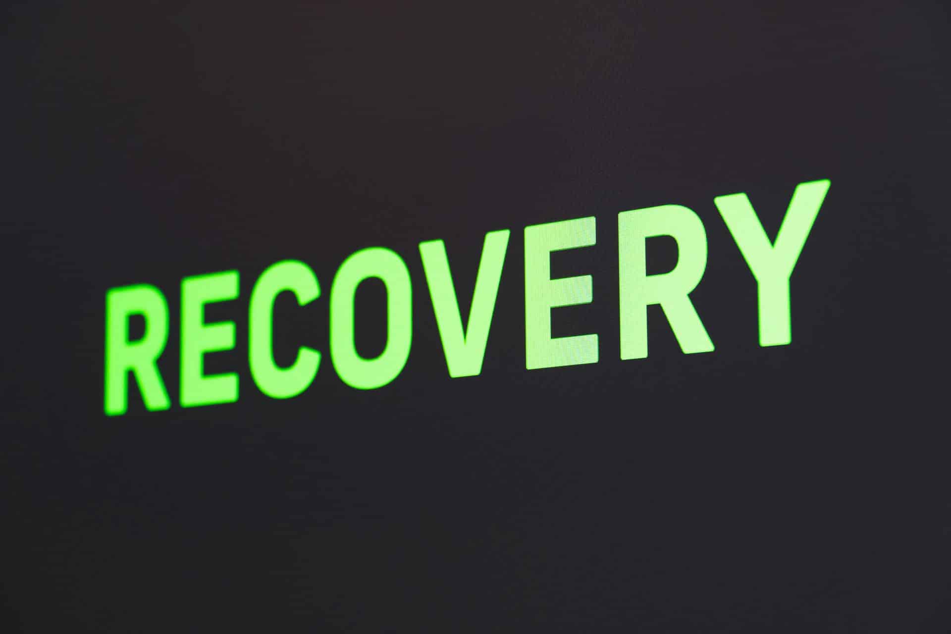 a close up of a sign that reads recovery